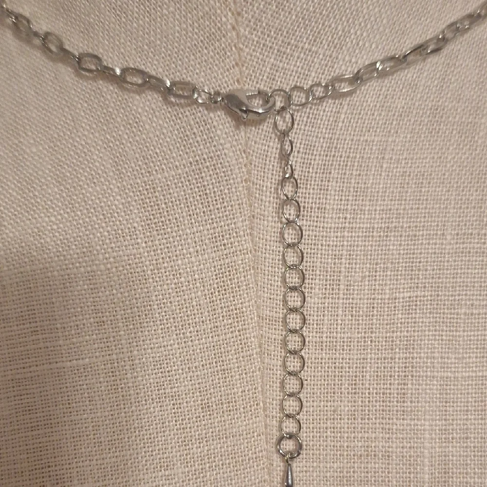 Elegant Silver and Red Bow Necklace